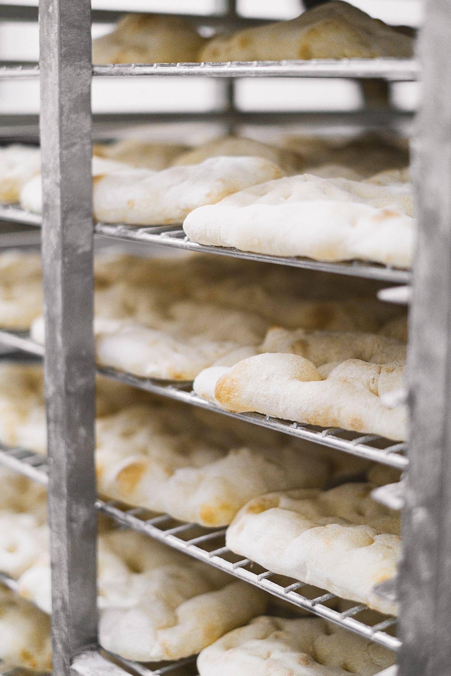 Bread cooling on bakery racks